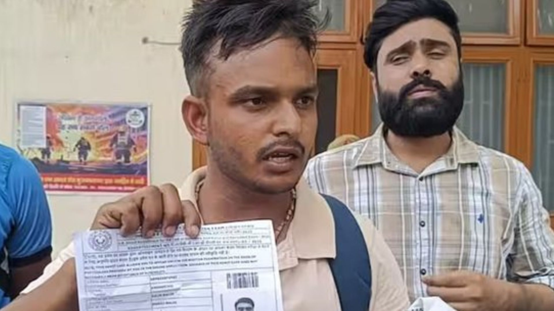 Student Showing his admit card