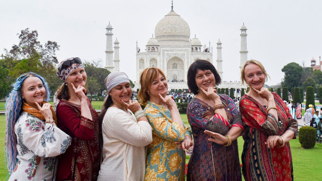 International tourists In front of Taj Mahal