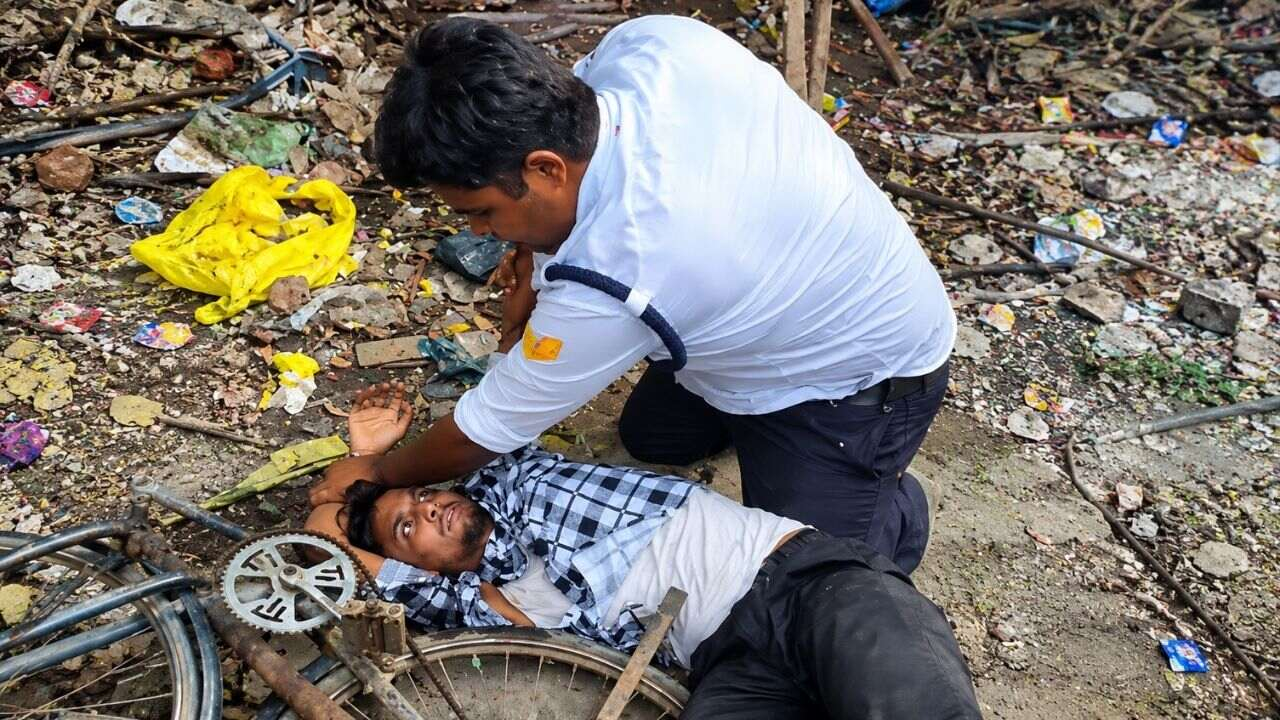 image of traffic police and bike rider fight