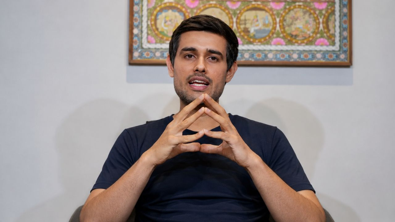 dhruv rathee addressing press
