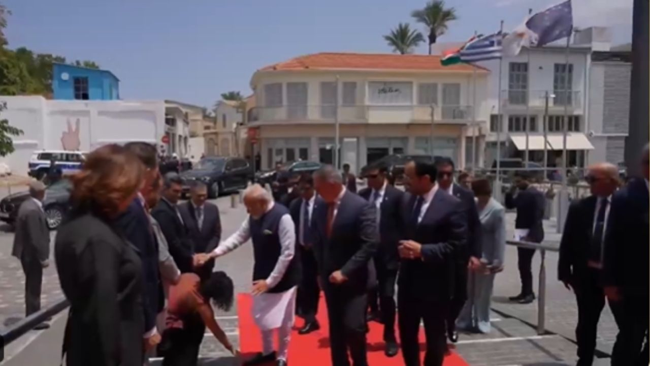 Nicosia Council Member touching feet of PM Modi । Photo Credit: Screengrab of video
