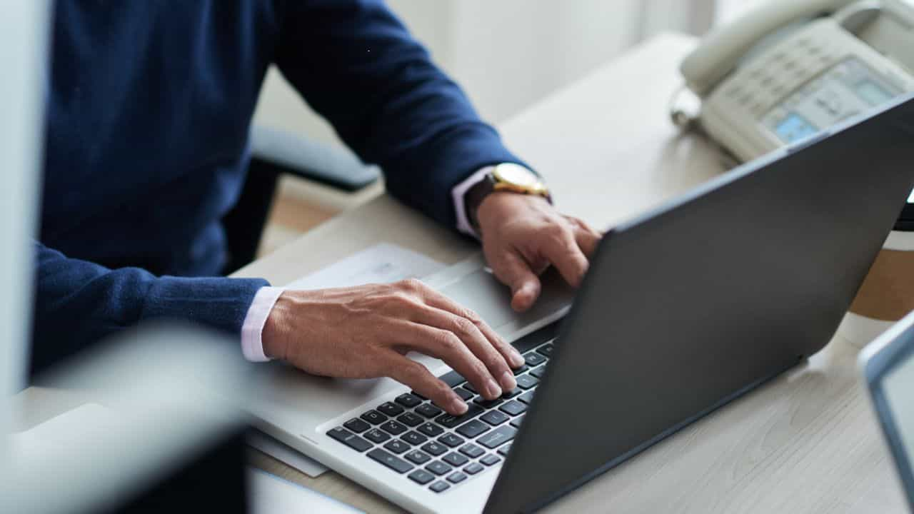 Image of man working on computer