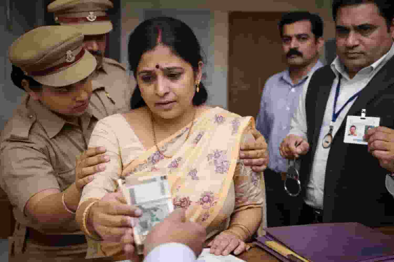 Woman accepting a bribe in office 