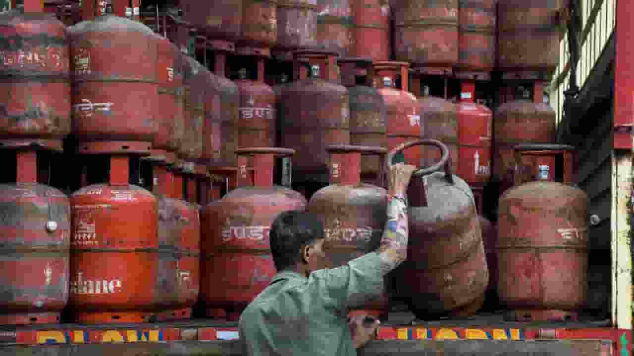 Worker loads LPG gas  cylinders