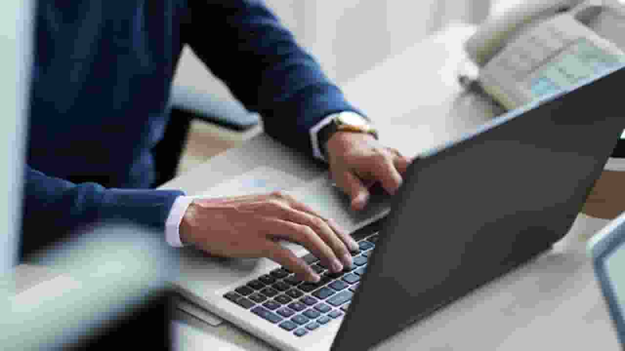 Image of man working on computer