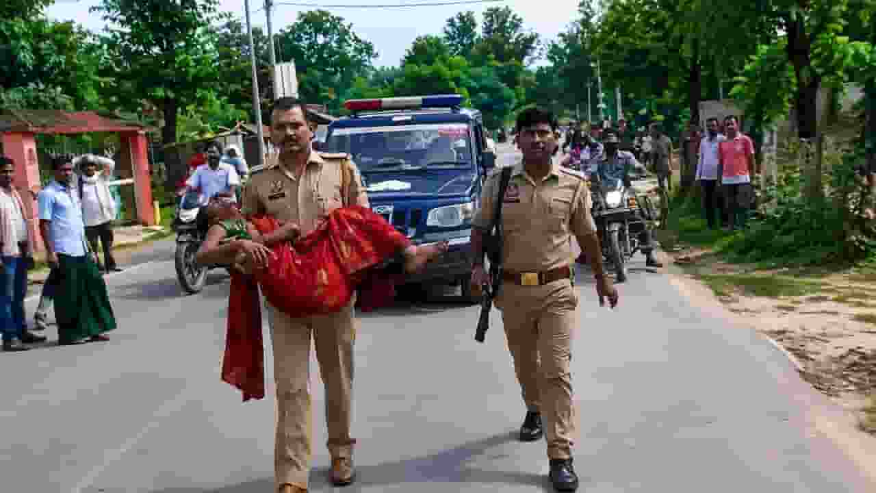 image of police carries injured woman