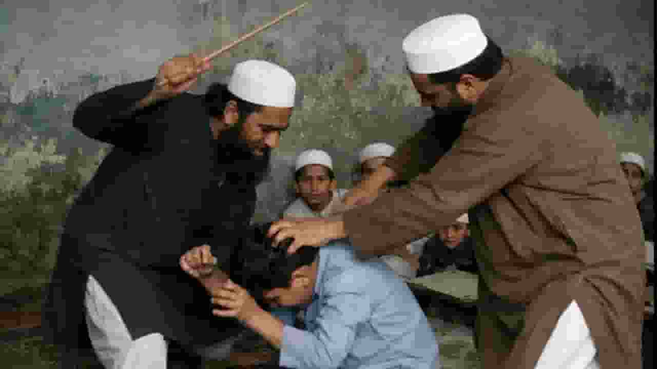  two Maulvis are brutally beating a boy 