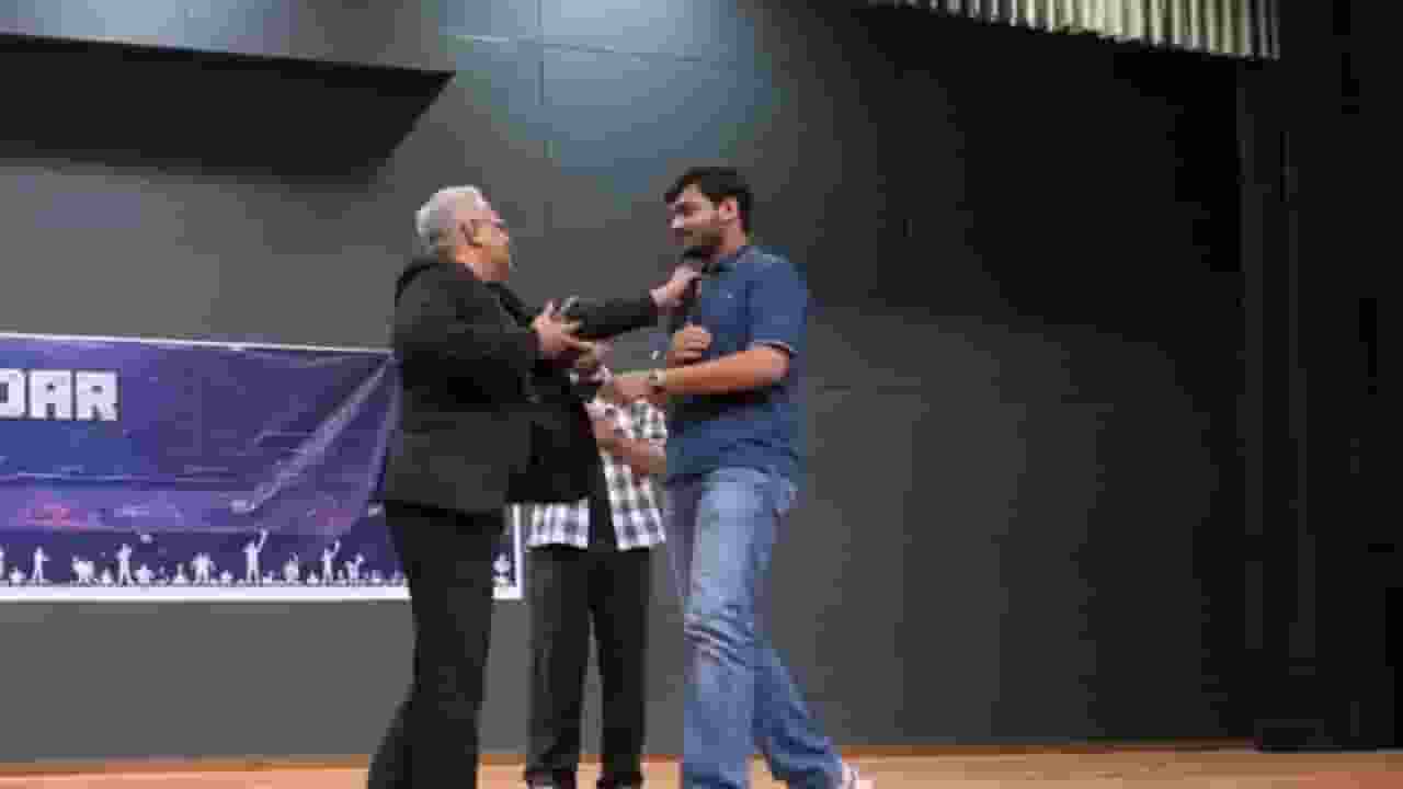 professor grabs student collar