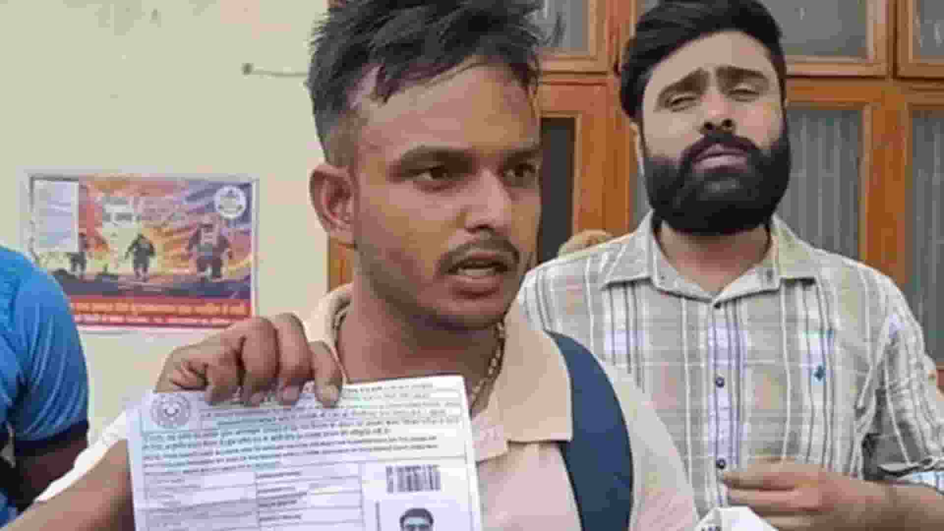 Student Showing his admit card